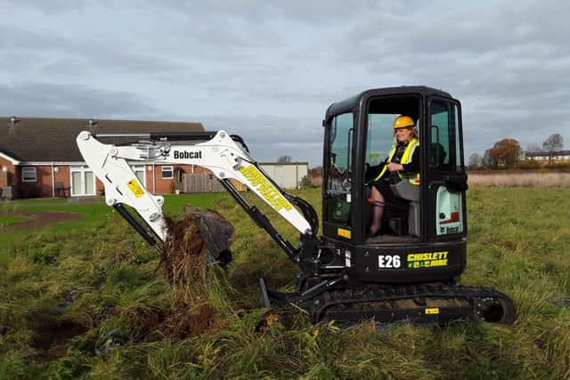 Butterfly Hospice Trusts Linda Sanderson starting the work on the Memory Garden.