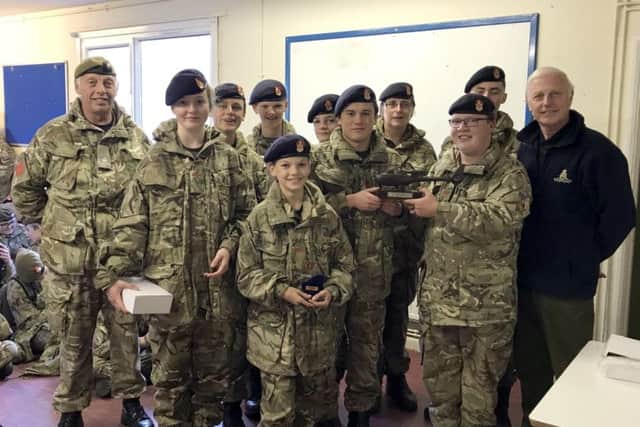 The Caistor cadet team with the trophy, Major Dance , Major Webber and detachment staff. EMN-171129-072818001