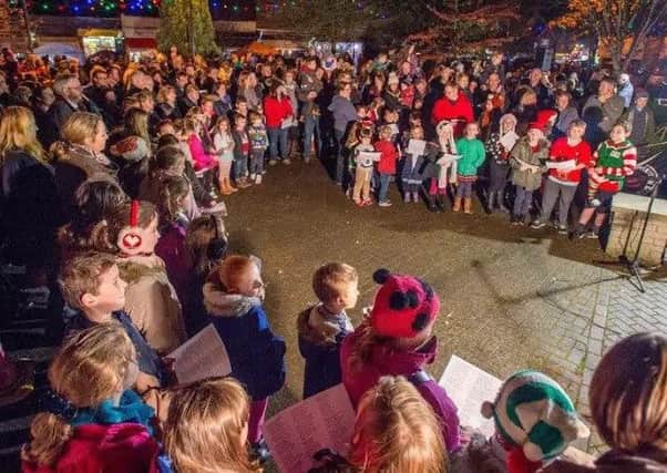 St Andrews, St Hughs and Kirkby On Bain Primary School choirs singing to the crowds at last year's Woodhall Spa Chrisrmas Market. EMN-171129-095514001