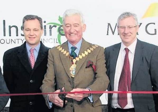 Lincolnshire County Council chairman David Dickinson cuts the ribbon to declare the A158 Burgh le Marsh bypass open 10 years ago with (from left) MP Mark Simmonds, managing director of May Gurney Steve Jagger and Burgh le Marsh Mayor Coun John Panton.