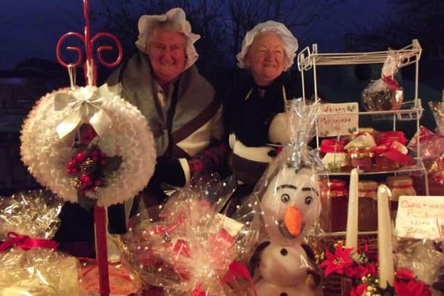 Stall holders at a previous Metheringham Christmas Market. EMN-171129-172709001