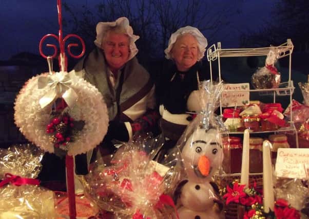 Stall holders at a previous Metheringham Christmas Market. EMN-171129-172709001