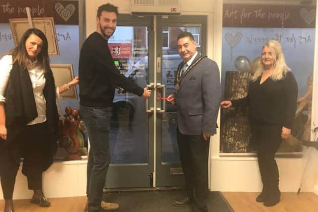Artist Ed Waite (left) opens Art for the People with Mayor of Skegness, Coun Danny Brookes, manageress Kasia Chotenovska, of Poland, and Maggie Rhodes. ANL-170112-155313001