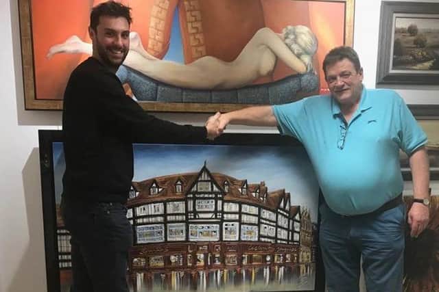 Artist Ed Waite (left) with the paiting Russ Sparkes had commissioned for his wife. Lesley. ANL-170112-155325001