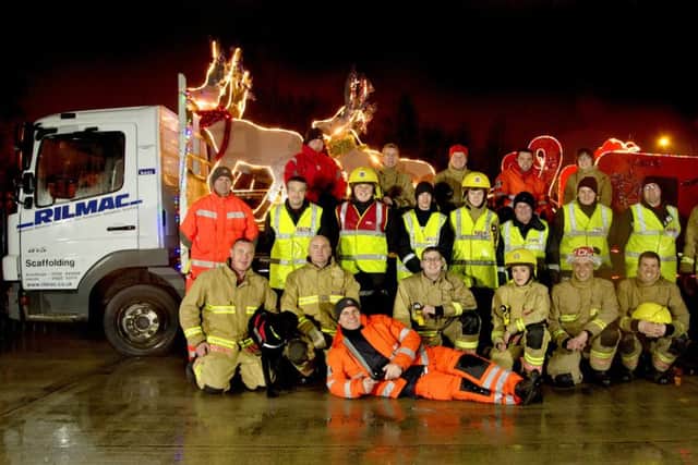 Lincoln North firefighters on a previous Santa sleigh run. EMN-170412-152003001