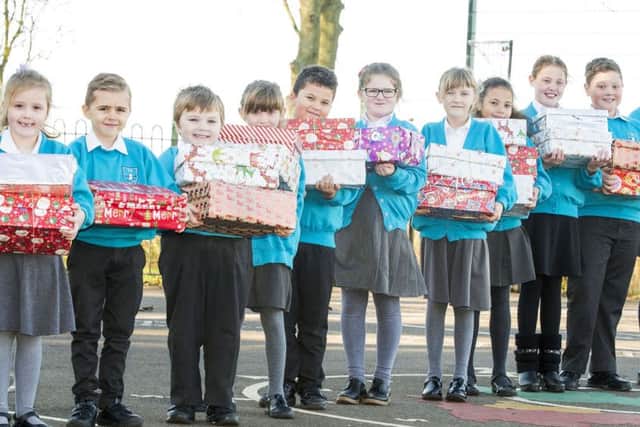Youngsters from Theddlethorpe have been busy filling Christmas shoeboxes for a good cause.