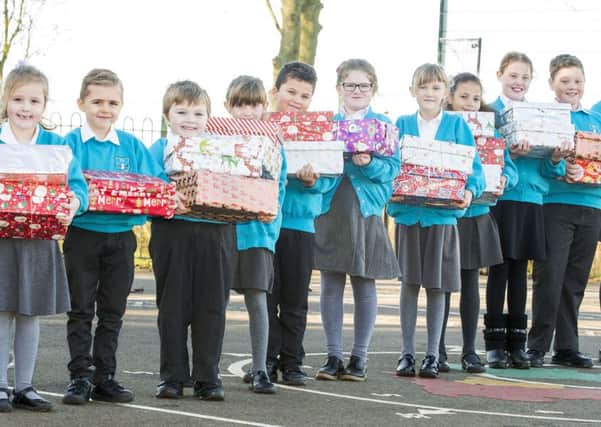Youngsters from Theddlethorpe have been busy filling Christmas shoeboxes for a good cause.