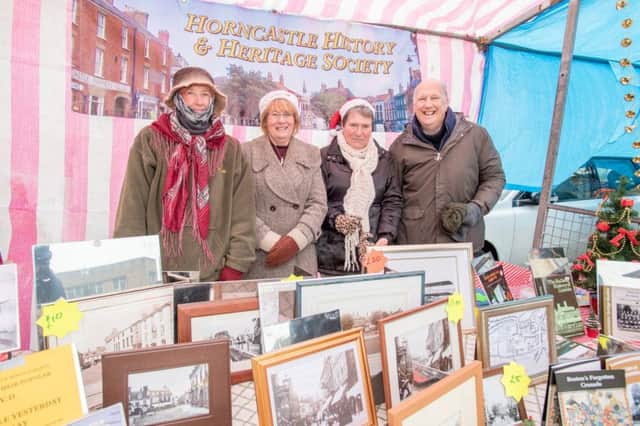 All wrapped up: Members of Horncastles History and Heritage Society were prepared for all weather at their stall.  EMN-171012-191120001