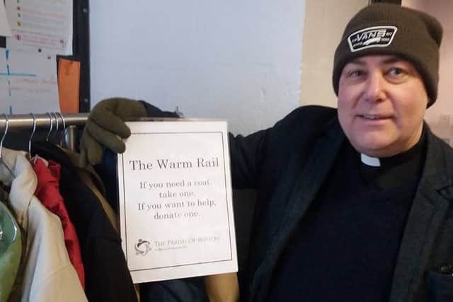 The Rev Steve Holt with the warm rail of donated winter coats at St Christophers Church, Boston.