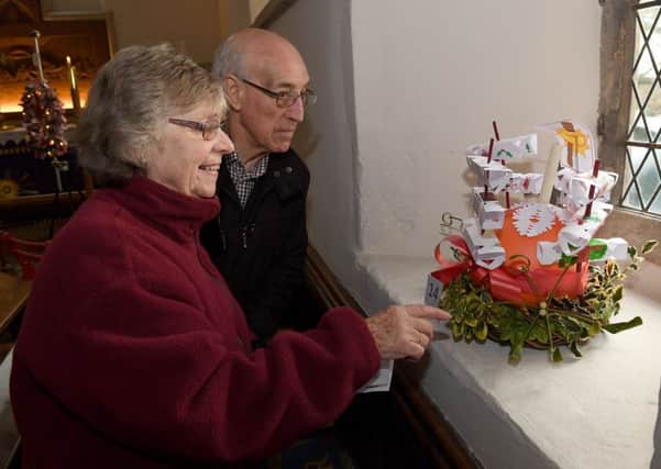 Wellingore parish church, wreath festival. Roy Hallworth and Brenda Thompson. EMN-170412-121909001