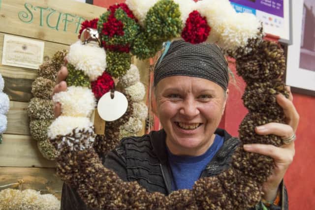 The Corn Exchange in Alford hosts its second Christmas Craft Fair.
Cat Darby with her pom pom wreaths
Picture: Sarah Washbourn.