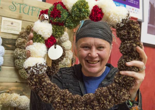 The Corn Exchange in Alford hosts its second Christmas Craft Fair. 
Cat Darby with her pom pom wreaths

Picture: Sarah Washbourn.
