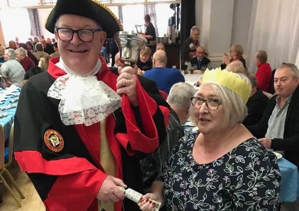 Chapel Town Crier Peter Keeffe with Susan Shaw of Chapel St Leonards at the Feed 1000 event for pensioners taking place this week at the Grosvenor House Hotel in Skegness. ANL-171112-185859001