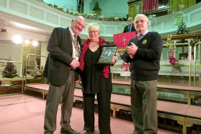 Margaret Smith received the community award from Rotary President Tony Maund EMN-171214-072315001
