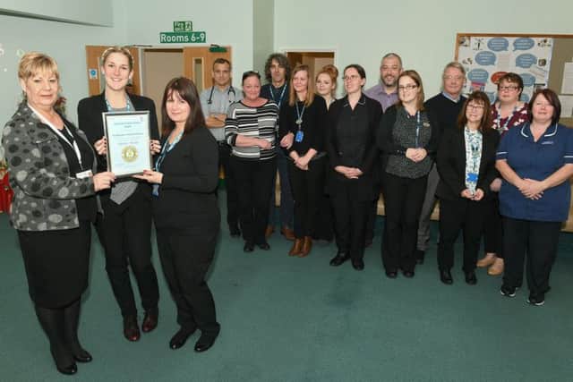 Ruskington Medical Practice being awarded Carers Quality Award by Julie Goy. Front L-R Julie Goy with Carers Champions Rachel Fisher and Sarah Blackbourn. EMN-170712-160208001