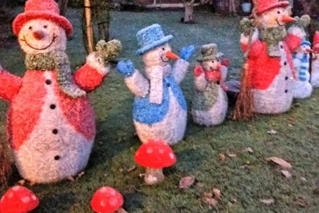 A parade of snowmen adorn the garden at Westwold Cottage. EMN-171213-161448001