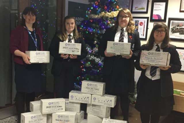 Students and staff with some of the boxes.