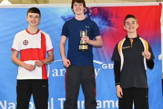 Jacob (left), wearing the England shirt, on the second step of the podium after claiming his national silver medal EMN-171214-083437002