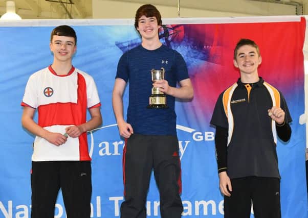 Jacob (left), wearing the England shirt, on the second step of the podium after claiming his national silver medal EMN-171214-083437002