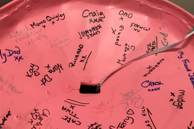 People are being encouraged to sign the pink litter bin inside and drop in a donation in aid of two cancer charities.