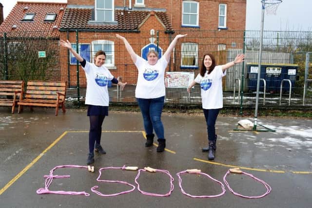 Pictured is Alex Sturman (PE co-ordinator), Sam Gilbert (mother who nominated the school) and Becky Dhami, (Headteacher of North Cockerington Primary School).