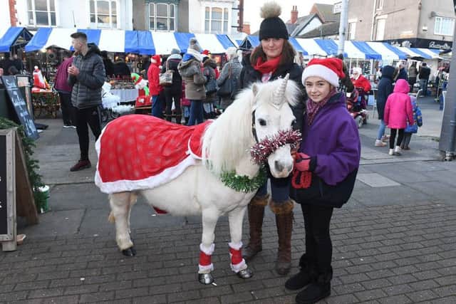 Mablethorpe Christmas Market. Leanne Maginnis and Millie Seabrooke 11 with Charlie the pony, The Stables Pony Parties, sutton on sea.