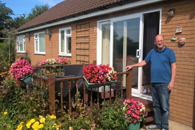 Robert Finlay outside the bungalow.