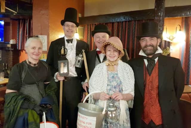 Jo Johnston, Mike Eckersley, Keith Winnard, Emma Eckersley and Fr Robert Thacker in the Aston Arms on their carolling tour of the town EMN-171218-123547001