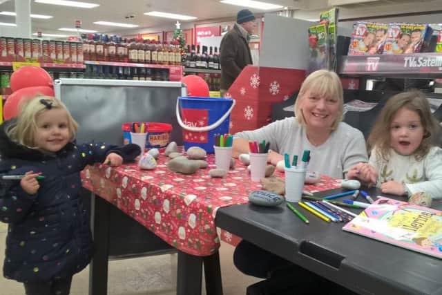 Mrs Pallett is pictured with three-year-olds Isla Nickless (right) and Hetty Conduit who obviously enjoyed painting more than shopping.
