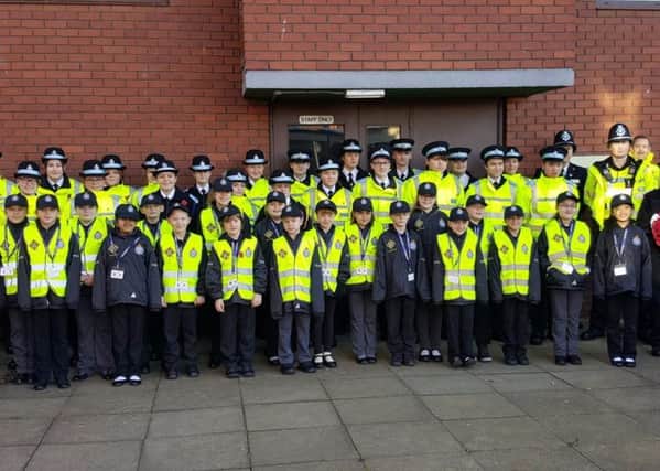 Mini Police pictured with police cadets ready for the Remembrance Parade in November.