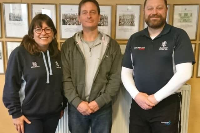Carolyn Bray Boston Rugby Clubs minis and juniors chairman  (left) with Simon Upton, father of the 19-year-old who lost everything in the fire at his and his partner's house, and club chairman Steve Loveley. NA