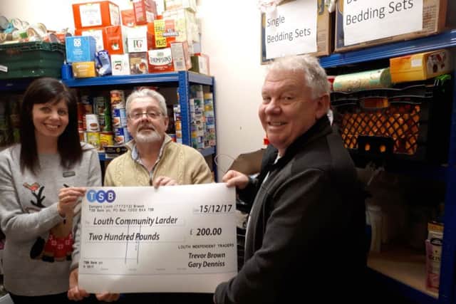 Rachael Wood (LIT), Gary Denniss (LIT chairman) and Greg Gilbert, the community outreach manager at the Trinity Centre.