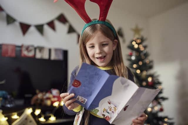 See your child's face light up as they receive a letter from Santa. EMN-171219-105309001