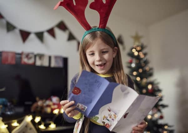 See your child's face light up as they receive a letter from Santa. EMN-171219-105309001