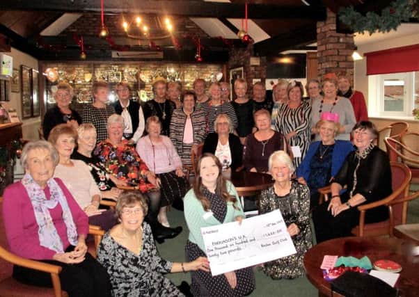 Lucy Dalgress collected the cheque at the section's Christmas Lunch, from Janet Read - on behalf of Kath Yates -  and Sandra Sharpe.
