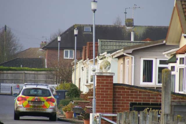 Police at the scene of the fire on Claremont Park, Sleaford, as investigators piece together how the blaze started. EMN-171220-102204001