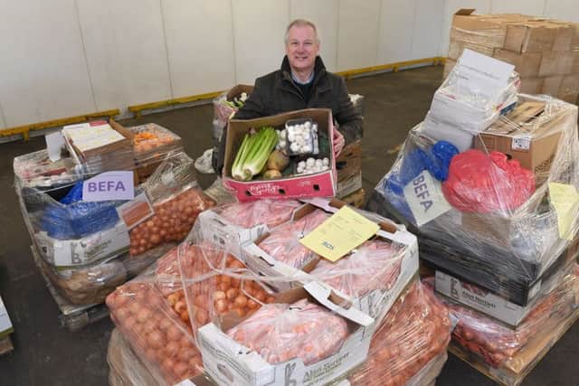 Food for charities being collected from Martin's Produce, Boston. Rev Steve Holland with some of the food. EMN-171220-104800001