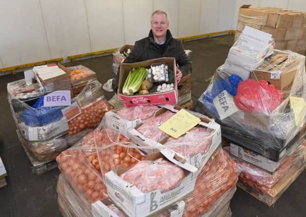Food for charities being collected from Martin's Produce, Boston. Rev Steve Holland with some of the food. EMN-171220-104800001