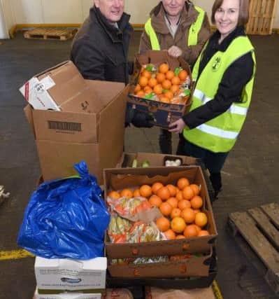 Food for charities being collected from Martin's Produce, Boston. Rev Steve Holland with Liz Hopkins - CEO of Centrepoint Outreach and John Hopkins. EMN-171220-104811001