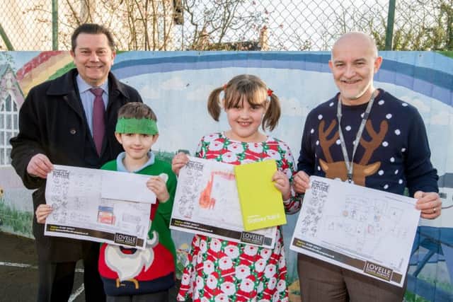 Lovelle Estate Agents organised a Design A House of the Future competition.  Winner Martha Fosdyke and Austin Reynolds-Allen (3rd) are  pictured (left) with Simon Jory and Garth Hicks.