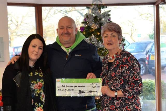 Andrew Shearman and Louise Butler (left) handed over a cheque for £1,450 to Ruth Tuxford of Lindsey Lodge (right). EMN-171220-145722001