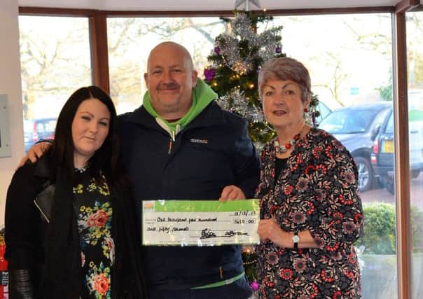 Andrew Shearman and Louise Butler (left) handed over a cheque for Â£1,450 to Ruth Tuxford of Lindsey Lodge (right). EMN-171220-145722001