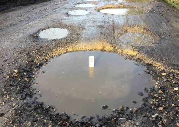 Some of the many potholes in Dog Kennel Wood which have been the subject of numerous complaints to the county council. EMN-171220-154443001