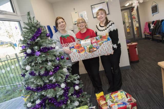 Staff from Maple Leaf Nursey at RAF Digby with donations from parents that have been delivered to Sleaford Larder, a food bank set up by Sleaford's New Life Church Community.
Picture: Sarah Washbourn/www.yellowbellyphotos.com EMN-171220-164822001