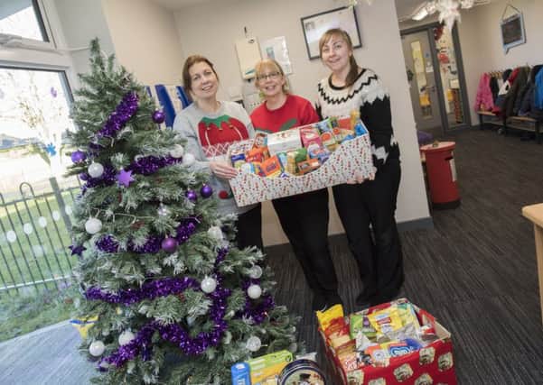 Staff from Maple Leaf Nursey at RAF Digby with donations from parents that have been delivered to Sleaford Larder, a food bank set up by Sleaford's New Life Church Community.
Picture: Sarah Washbourn/www.yellowbellyphotos.com EMN-171220-164822001