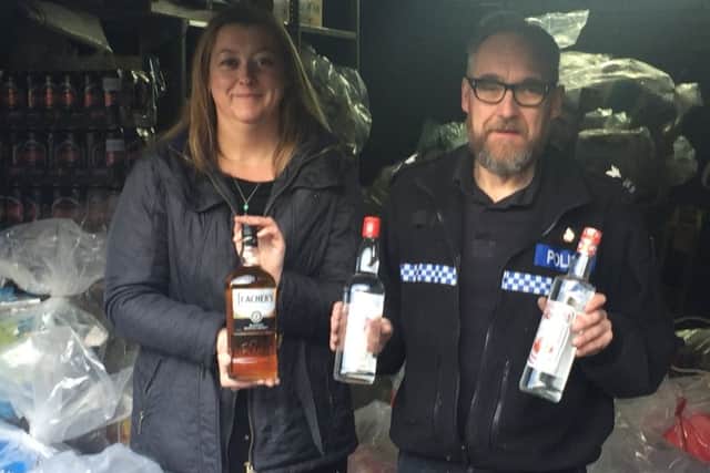 Tackling counterfeit goods ... Emma Milligan and Sgt Kimble Enderby.