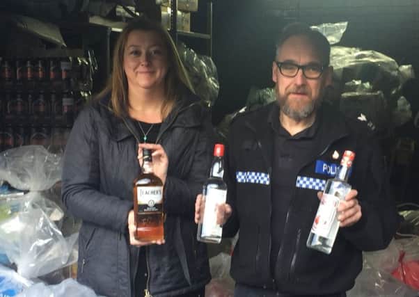 Tackling counterfeit goods ... Emma Milligan and Sgt Kimble Enderby.