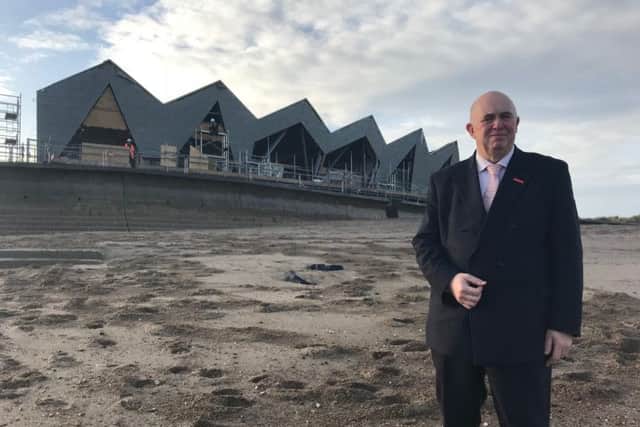 Coun Colin Davie on the beach near the new North Sea Observatory at Chapel St Leonards, which it is hoped will open at Easter. ANL-171221-152337001