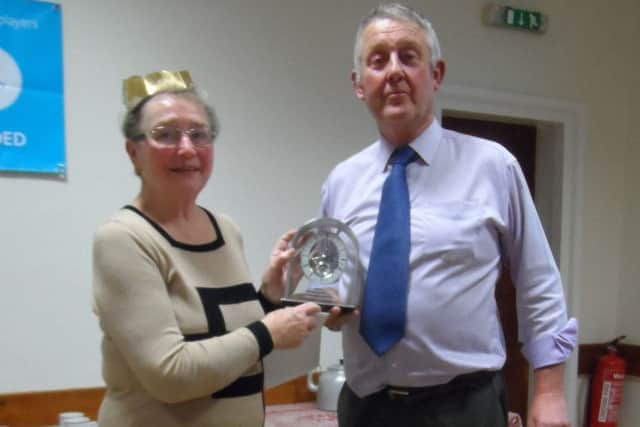 Maureen receives the skeleton clock from Andrew Jacklin.