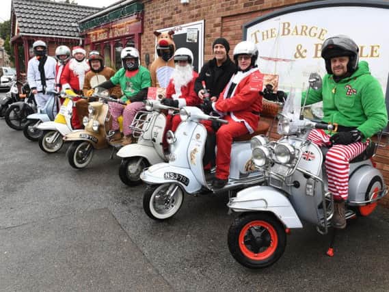 Sleaford All-Knighters scooter club set off from the Barge and Bottle in Sleaford on their mince pie run to a local care home.